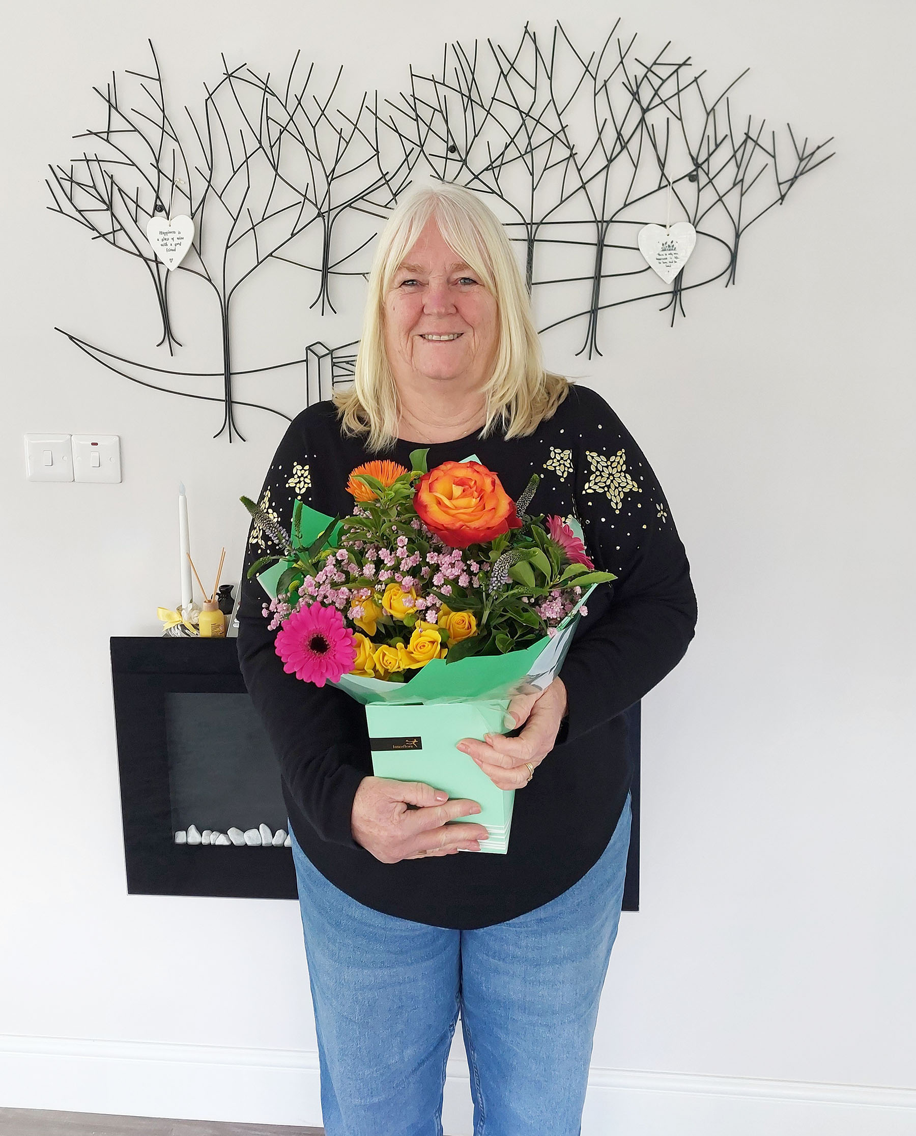 Toni with her flowers from the Exec