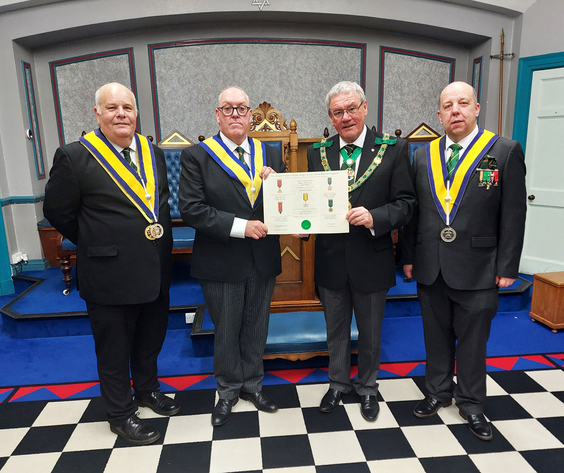 The D.G.P. Presents a Grand Council Certificate to Bro. John Jerome attended by W.Bros Curtis and Clare