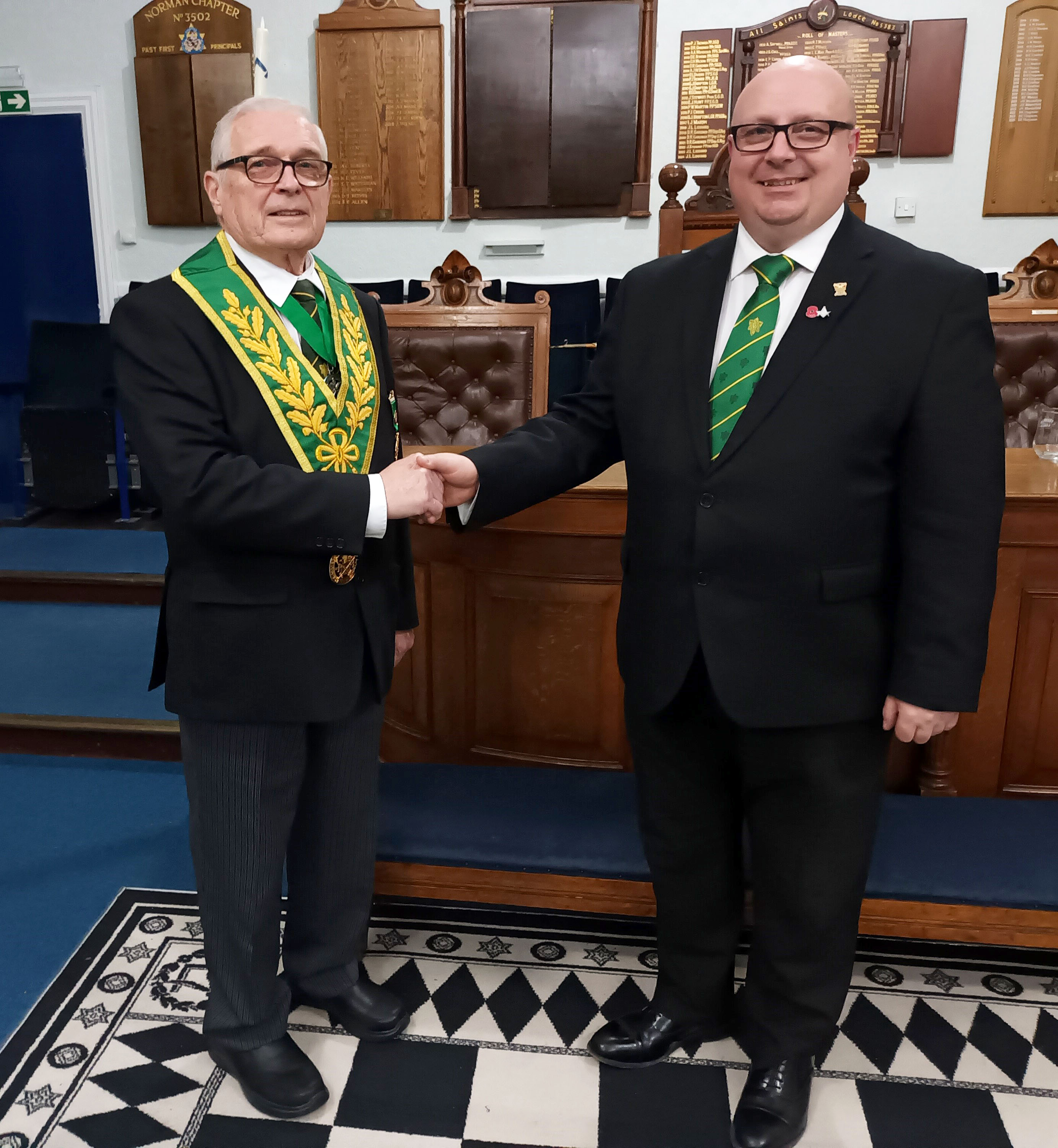 W.Bro. Derek Wilkins congratutates W.Bro. Christian Doll on being installed into the Chair