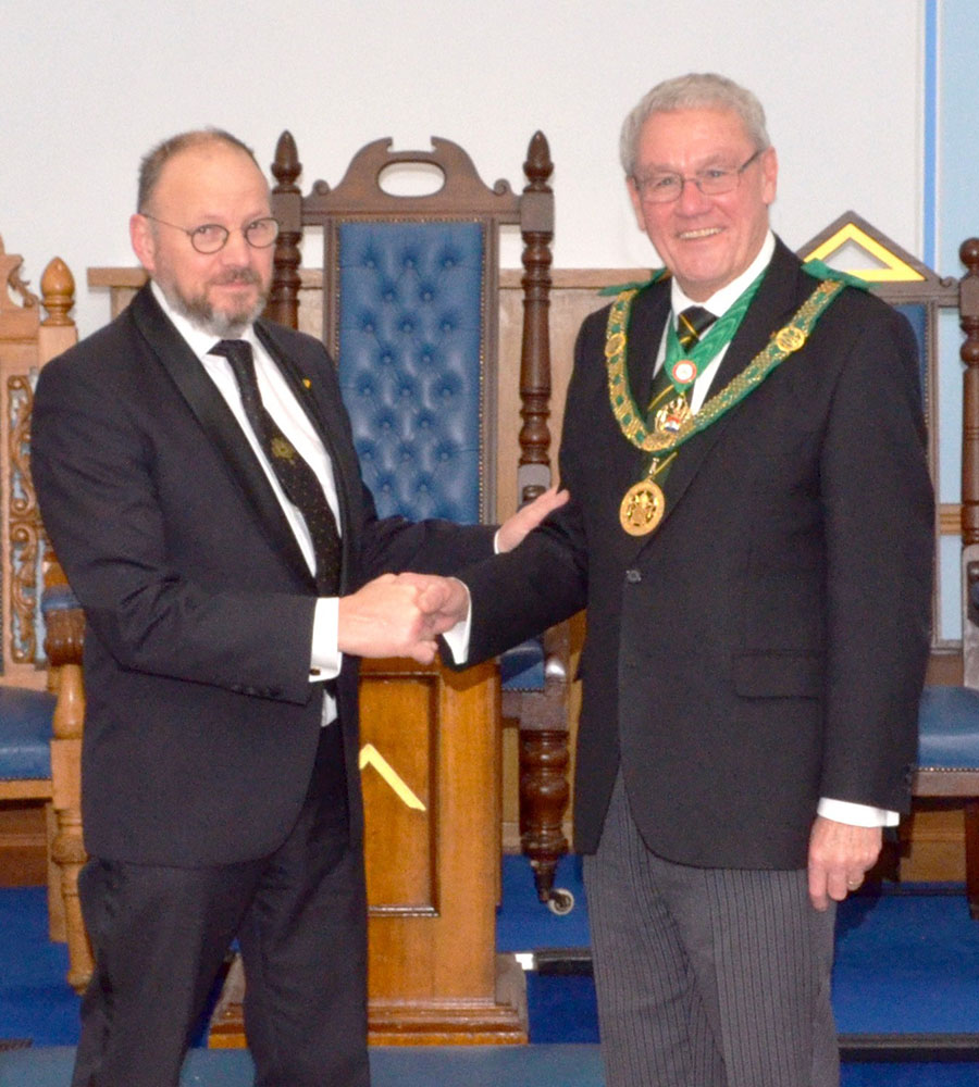 The District Grand Prefect. R.W.Bro. Brian Ward welcomes Bro. Rudi Degeest to the Order